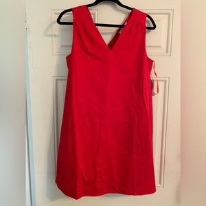 NEW WITH TAGS stunning red dress with pockets and accent type bow on back V